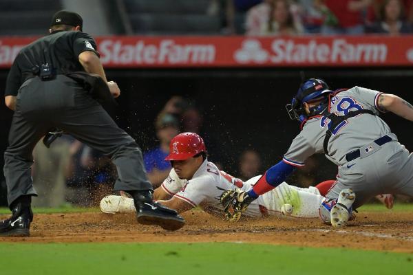 Angels bash three homers, end Rangers’ winning streak