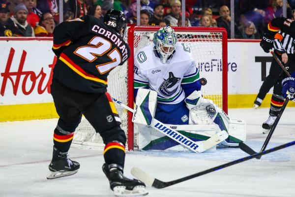 Flames get past Canucks, continue strong home form