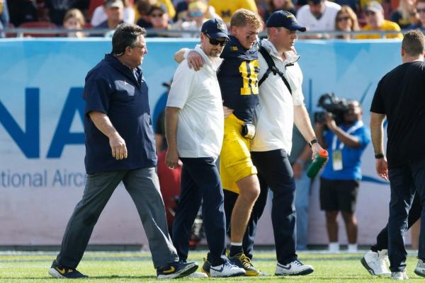 Michigan QB Davis Warren has torn ACL