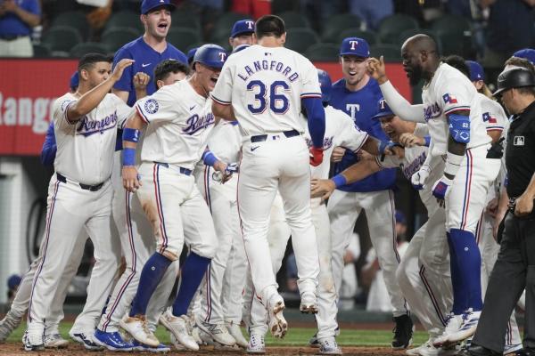 MLB roundup: Rangers sink Yanks on walk-off slam thumbnail