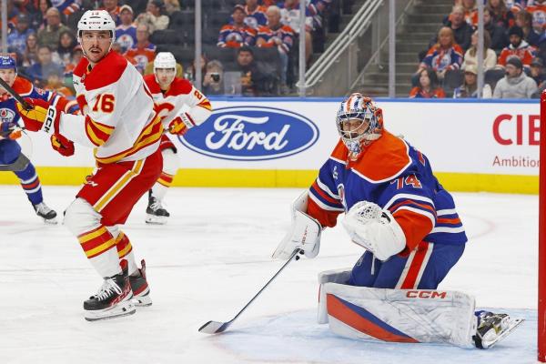 Flames escape 3-goal hole, outlast Oilers in marathon shootout
