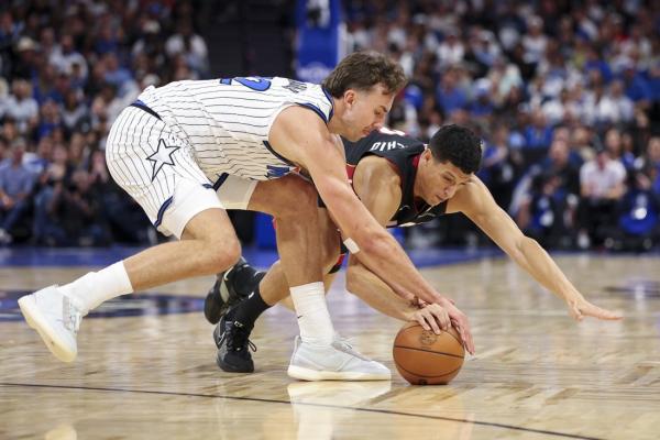 Magic ride last-minute heroics to opening win over Heat