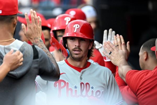 Phillies rally from four-run deficit to repel Rays in extras