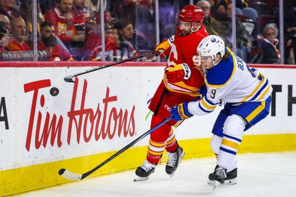 Flames score 3 in third to sink Sabres