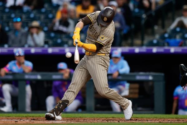 Padres build 11-run lead, withstand Rockies’ late rally