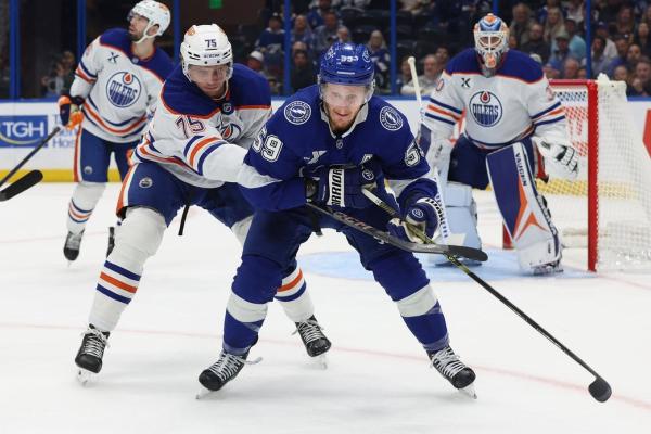 Lightning strike late, beat Oilers on wild OT sequence