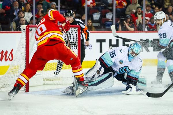 Flames score 3 goals in 3rd period, overtake Kraken