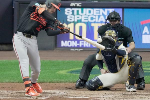 Orioles snap skid with 8-4 win over Brewers in 11