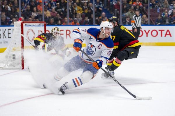 Oilers score 4 goals in third to pull away from Canucks