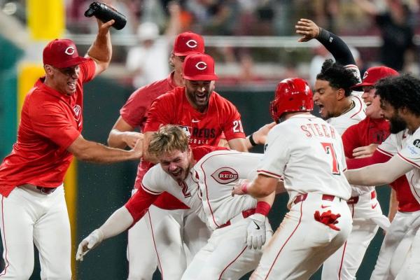 Reds rally late, walk off Yankees in extras