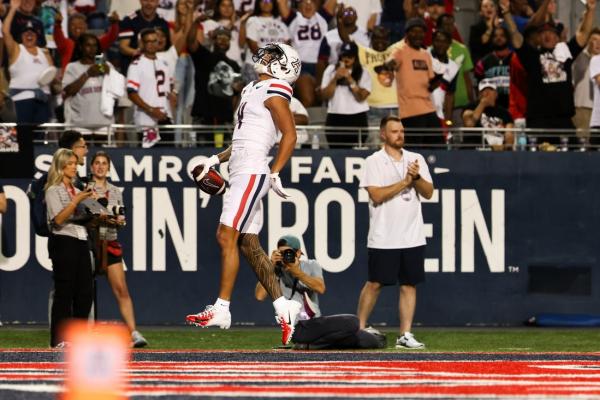 Tetairoa McMillan (304 receiving yards) helps No. 21 Arizona outlast New Mexico