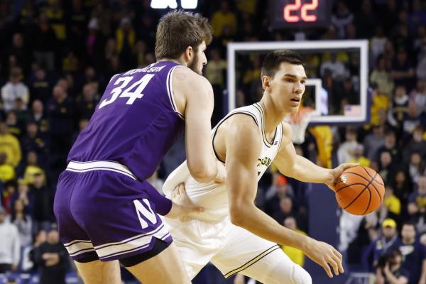 No. 20 Michigan fends off Northwestern in OT