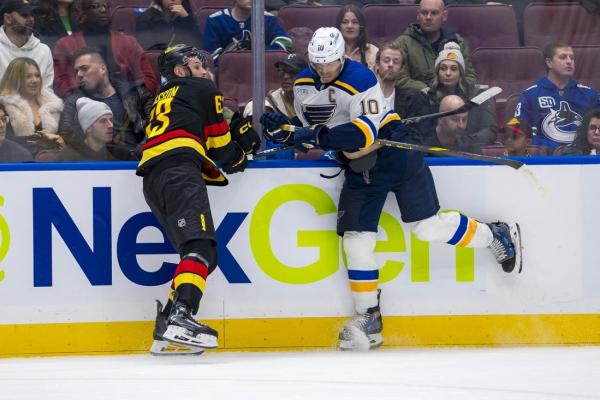 Blues use OT to hand Canucks another home loss