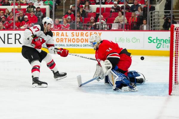 Hurricanes’ four-goal third period cools off Devils