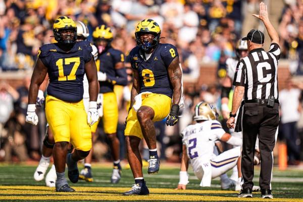 Two second-half interceptions fuel Wolverines past Huskies