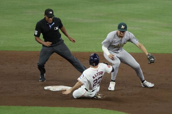 Bunt-fueled 12th-inning rally lifts A's over Astros thumbnail