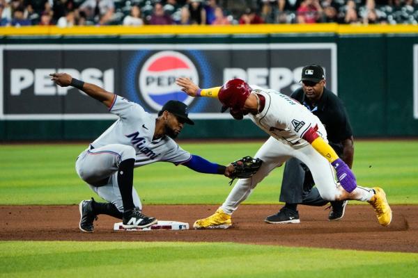 Marlins rally from 4 runs down to beat D-backs in 10 innings