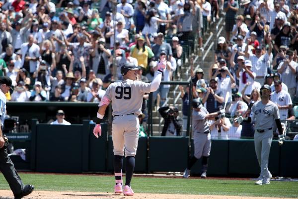 Athletics pile up runs late, come back to beat Yankees
