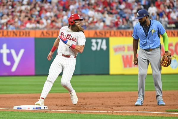 Phillies score five in eighth to pull away from Rays