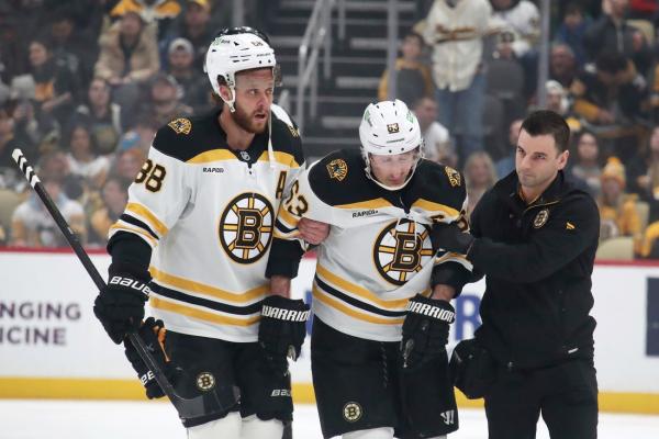 Bruins captain Brad Marchand leaves Penguins game with injury