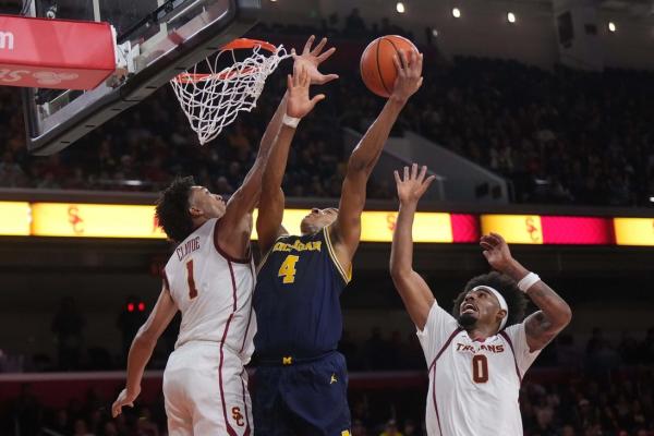 Michigan uses two late 10-0 runs to surge past USC