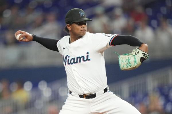 Marlins hold off late rally, top Padres to even series