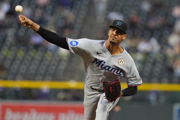 Marlins build 6-run lead, hang on for victory over Rockies