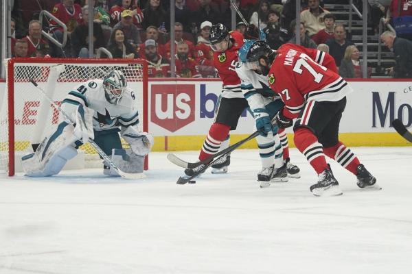 Blackhawks double up Sharks for win in home opener