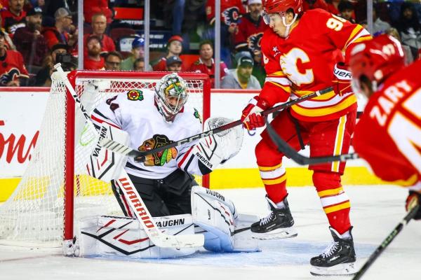 Flames best Blackhawks, match franchise mark at 4-0-0