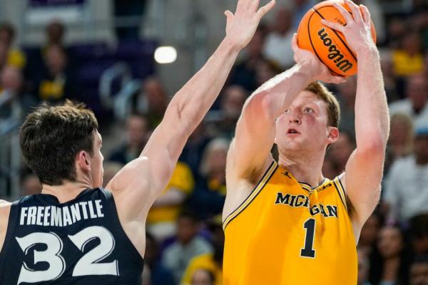 Iowa, Michigan out to build on close conference wins