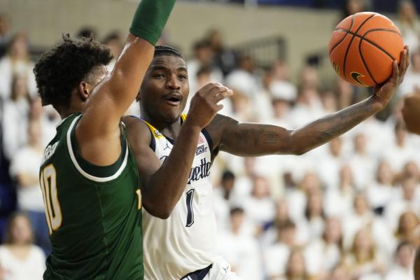 No. 18 Marquette pulls away late to thwart George Mason’s upset bid