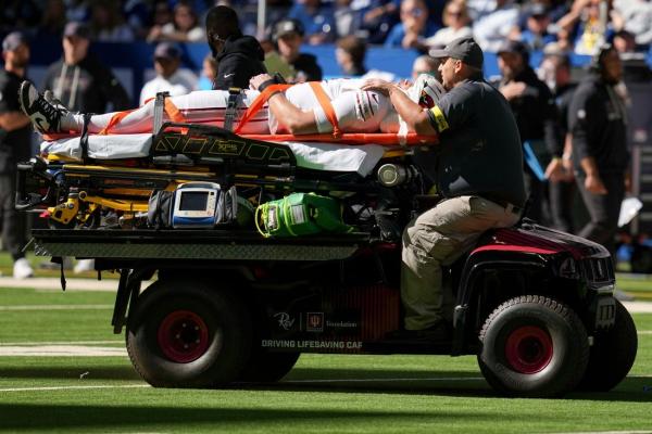Cardinalsâ Travis Vokolek (neck) taken off via stretcher; Marvin Harrison (concussion) also out