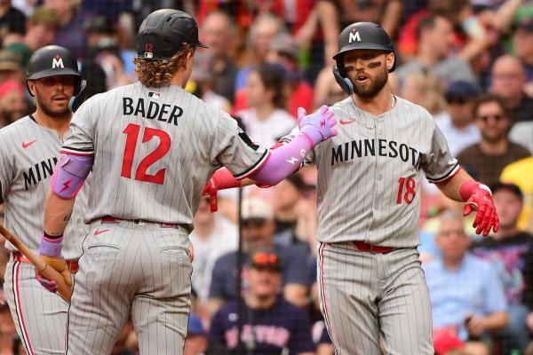 Twins wait out rain delay, hold off Red Sox to even set