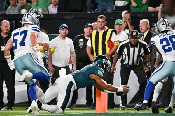 Eagles open title defense with tight win over Cowboys