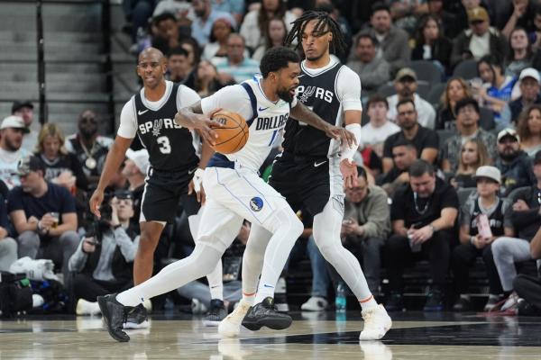 Undermanned Mavs hold off Spurs, snap 5-game skid