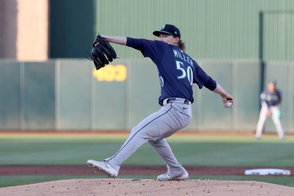 Athletics keep coming back to knock off Mariners in 11