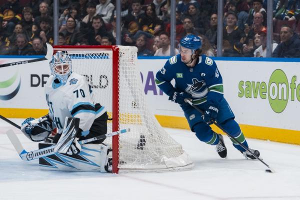 Utah rallies to beat Canucks for boost in playoff chase