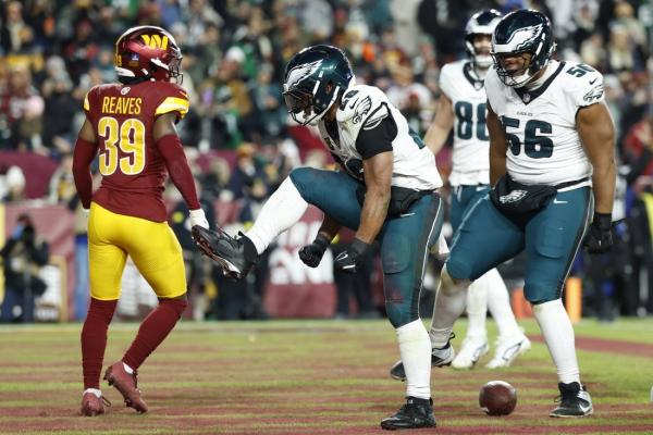 Saquon Barkley, Eagles clinch NFC East title with win over Commanders