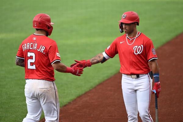 Nationals use 6-run inning to surge past Tigers, split DH