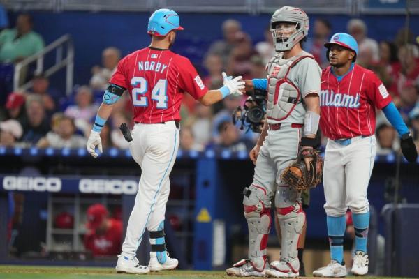 Marlins outslug Phillies to end their winning streak