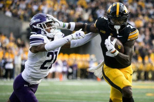 After 2nd-quarter QB change, Iowa reels off 35 unanswered to rout Northwestern