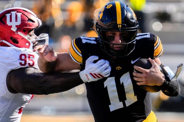 QB questions swirl on both sides of Iowa-Wisconsin showdown