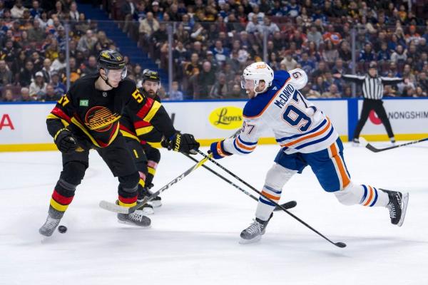 Two goals from Quinn Hughes help Canucks defeat Oilers