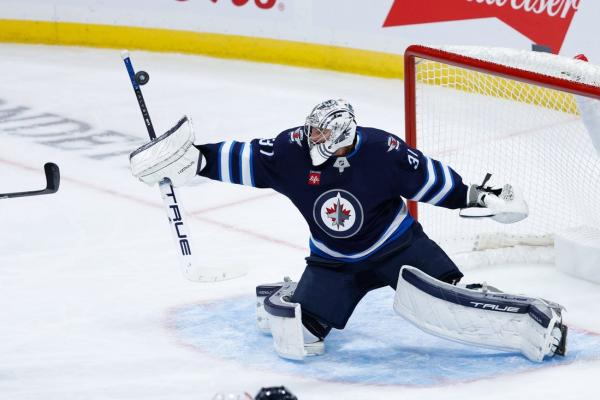 Jets’ Connor Hellebuyck faces Sharks in 500th career start