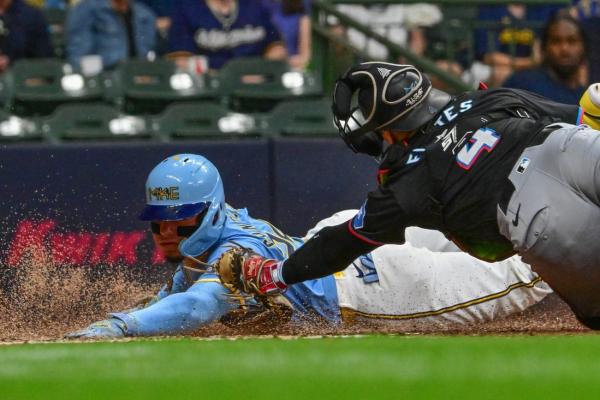 Early home runs steer Marlins past Brewers