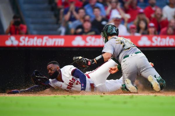 Reversed call lifts Athletics to win over Angels
